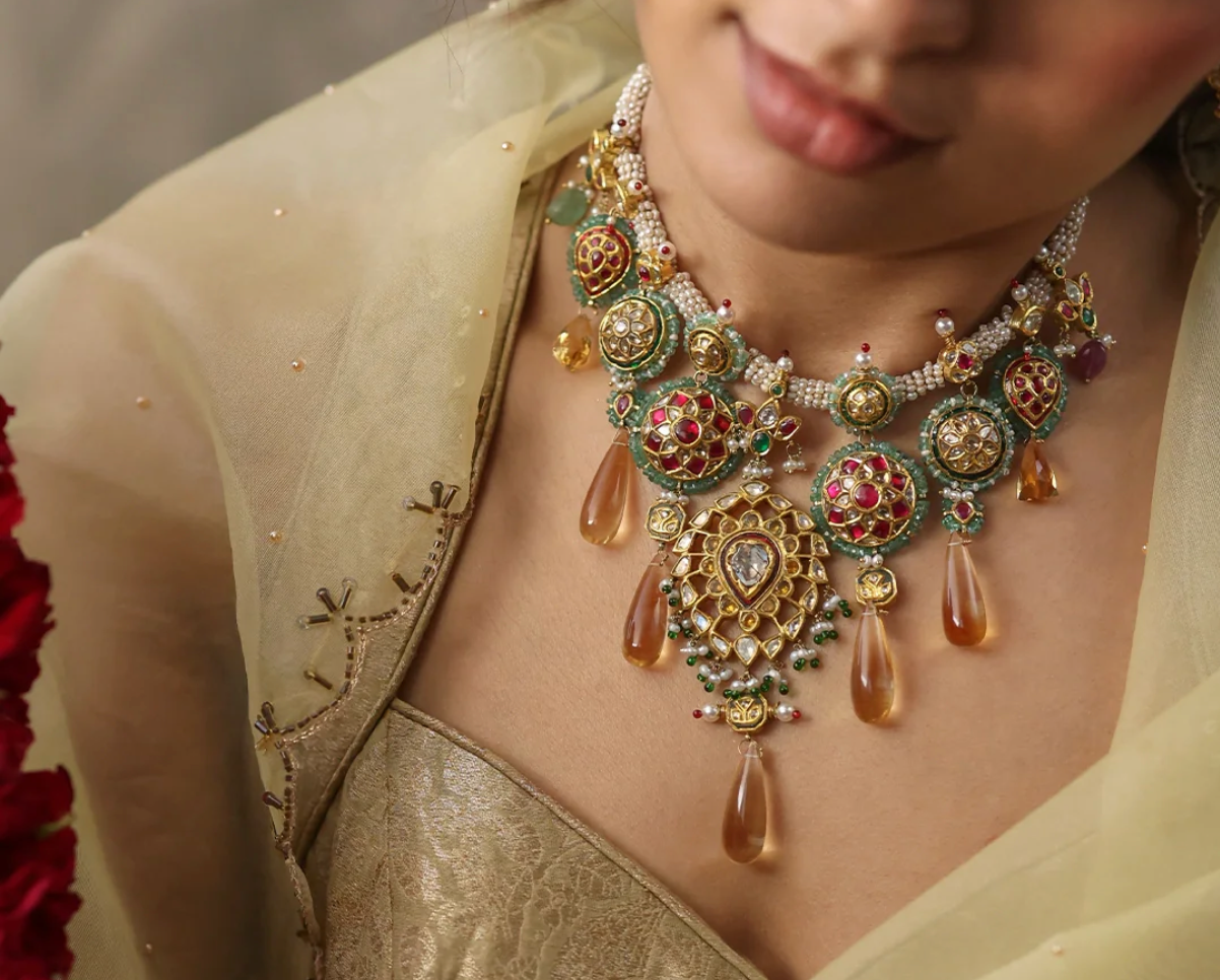 Mayura Necklace in handcrafted gold with polki (uncut) diamonds, showcasing heritage-inspired Indian bridal jewellery that complements red, pastel, and ivory bridal lehengas.