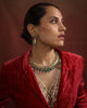 Kashi Hasli rigid gold torque necklace with hand-enamelled red and green floral vine, Polki diamond blooms, cultured pearl border, and graduating emerald drops