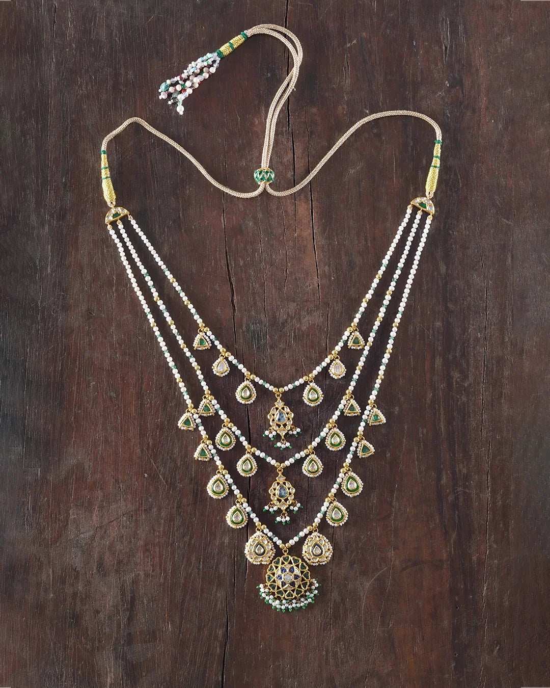 Keerat teenlada gold necklace with emeralds pearls and gemstone details