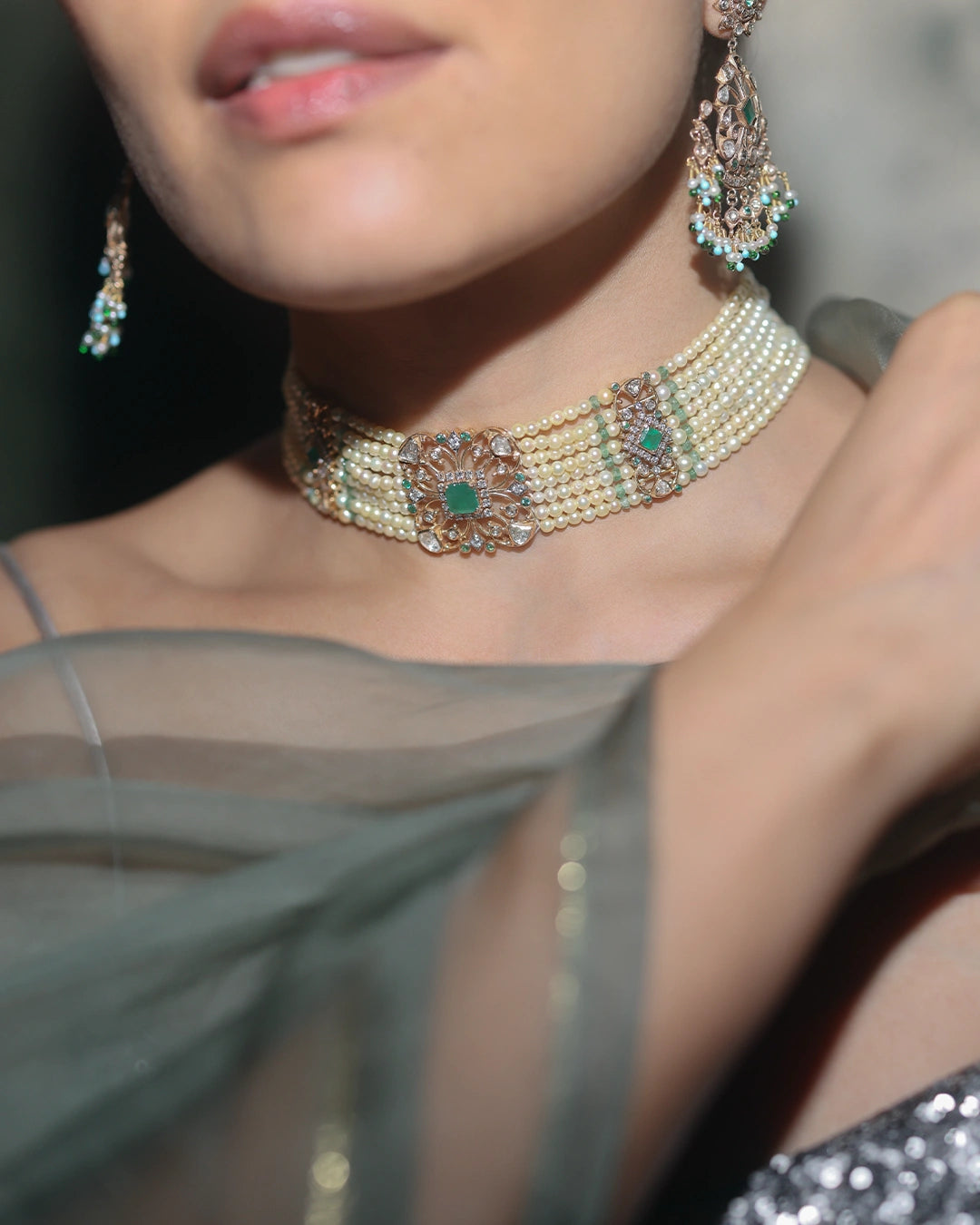 Keira gold bridal choker necklace featuring cultured pearls, natural brilliant-cut and rose-cut diamonds, and a faceted emerald centre, handcrafted using traditional Hyderabadi jewellery techniques.