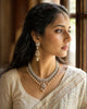 Model wearing the Aurus Jewels Mukta Necklace - a gold diamond and cultured pearl necklace with cascading drops and a central pendant, styled gracefully at the neckline