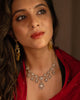 Model wearing the Aurus Jewels Naaz Necklace in 18k gold, styled at the neckline - a handcrafted diamond necklace with rose-cut diamond drops and brilliant-cut halo motifs.