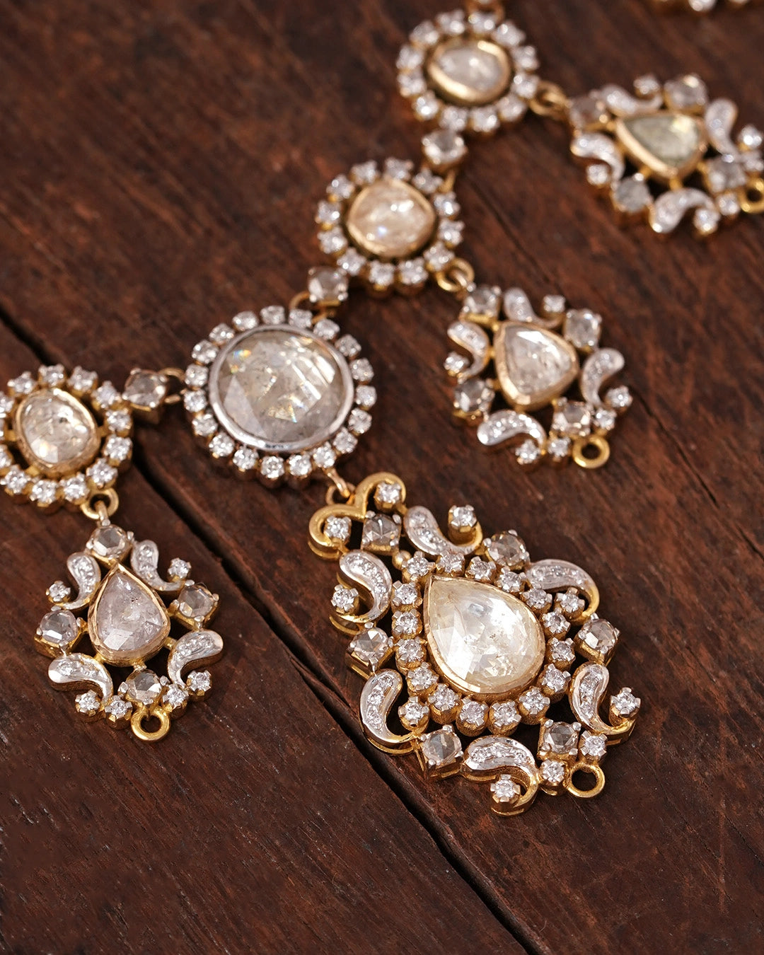 Close-up of the Naaz Necklace showing the natural rose-cut diamond centres, brilliant-cut diamond halos, and intricate gold-set motifs.