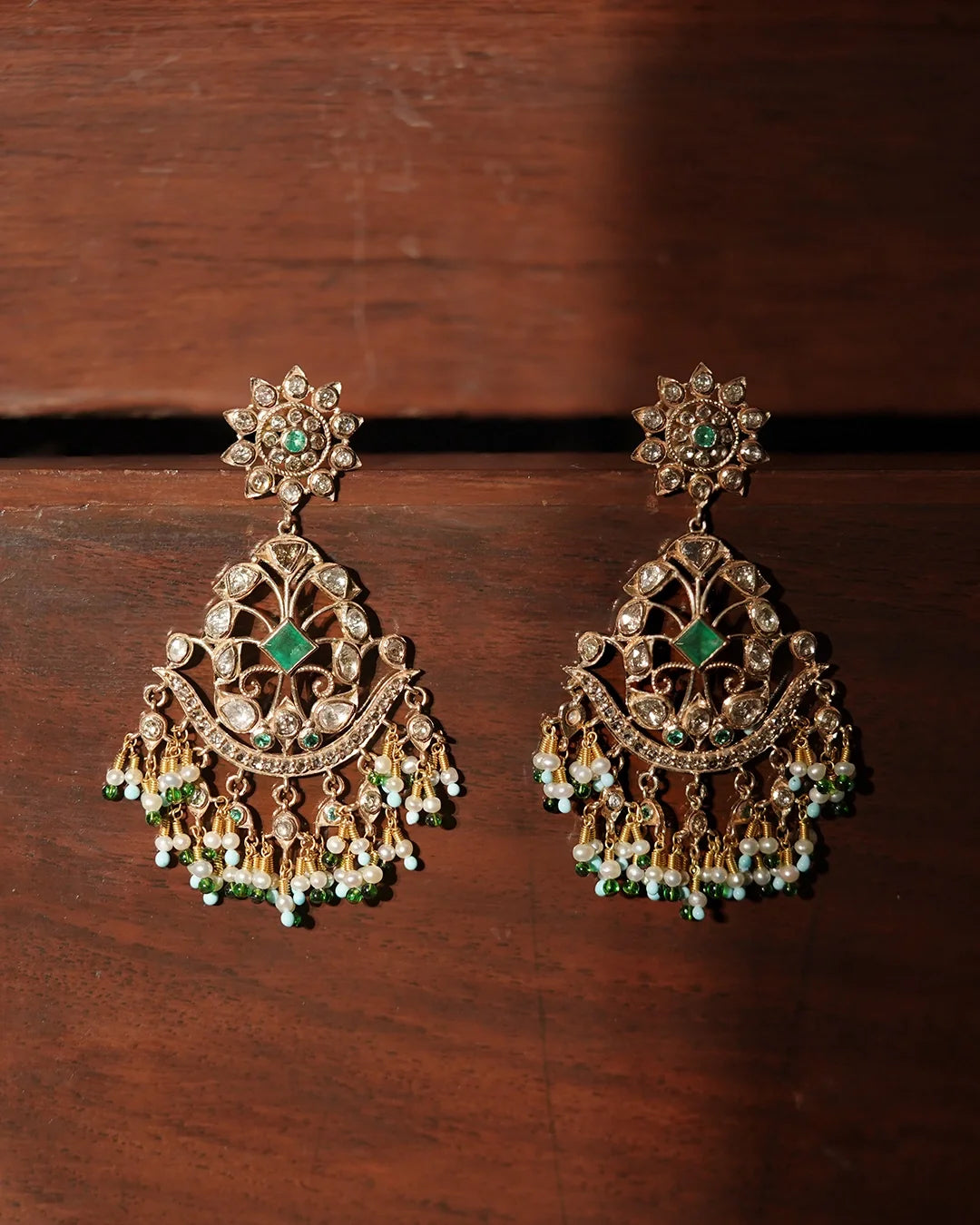 Gold Nehir Earrings with rose-cut diamonds, emerald accents, and pearl drops