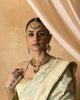 Rati gold polki necklace with uncut diamonds, wine-hued tourmaline drops, cultured pearls, green enamel accents, and intricate red meena work in a statement bridal jewellery design.