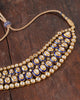 Vivir gold Polki collar necklace with graduated uncut diamonds and cobalt blue enamel borders, worn close to the throat